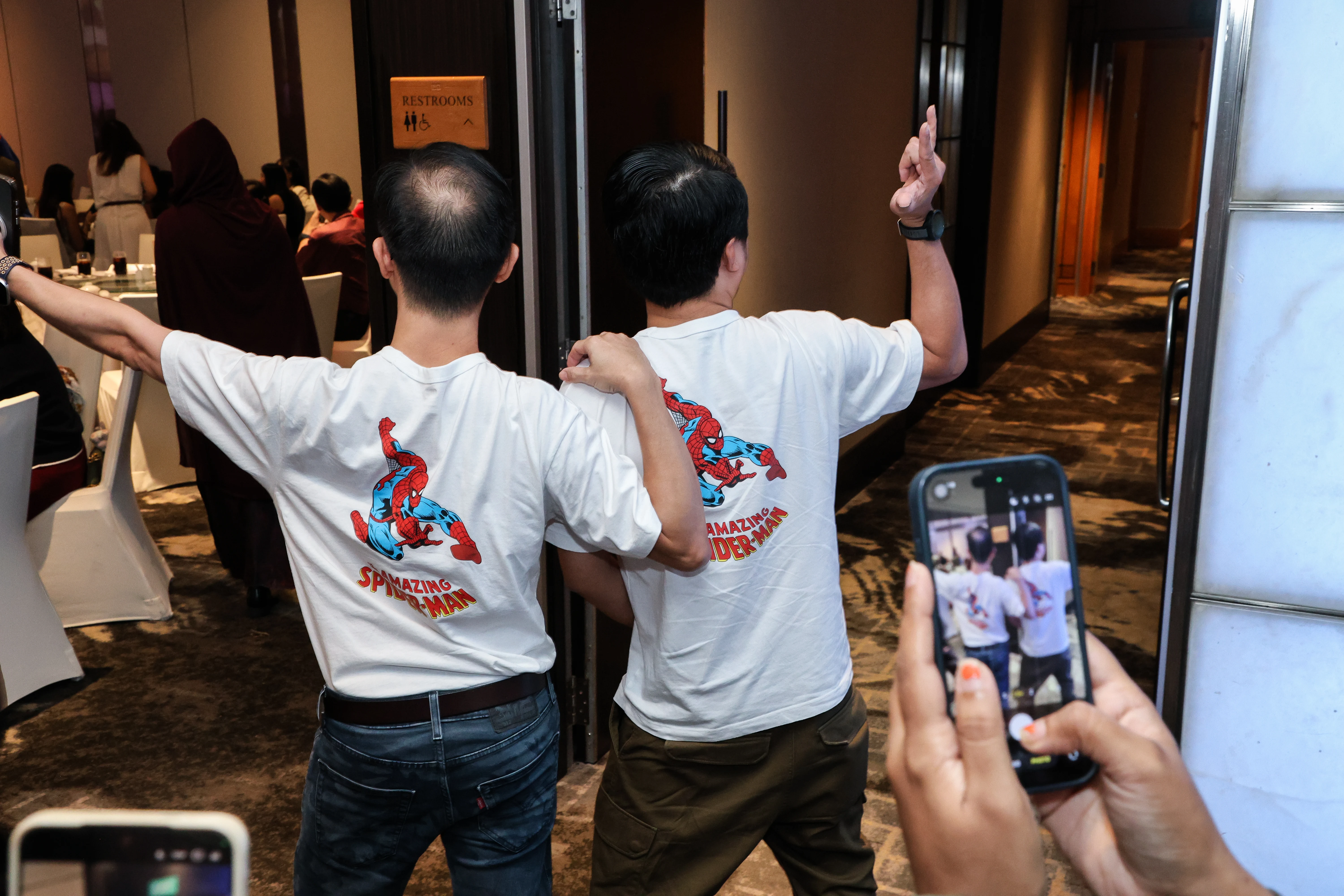 Guests participating in themed costume activities while being photographed