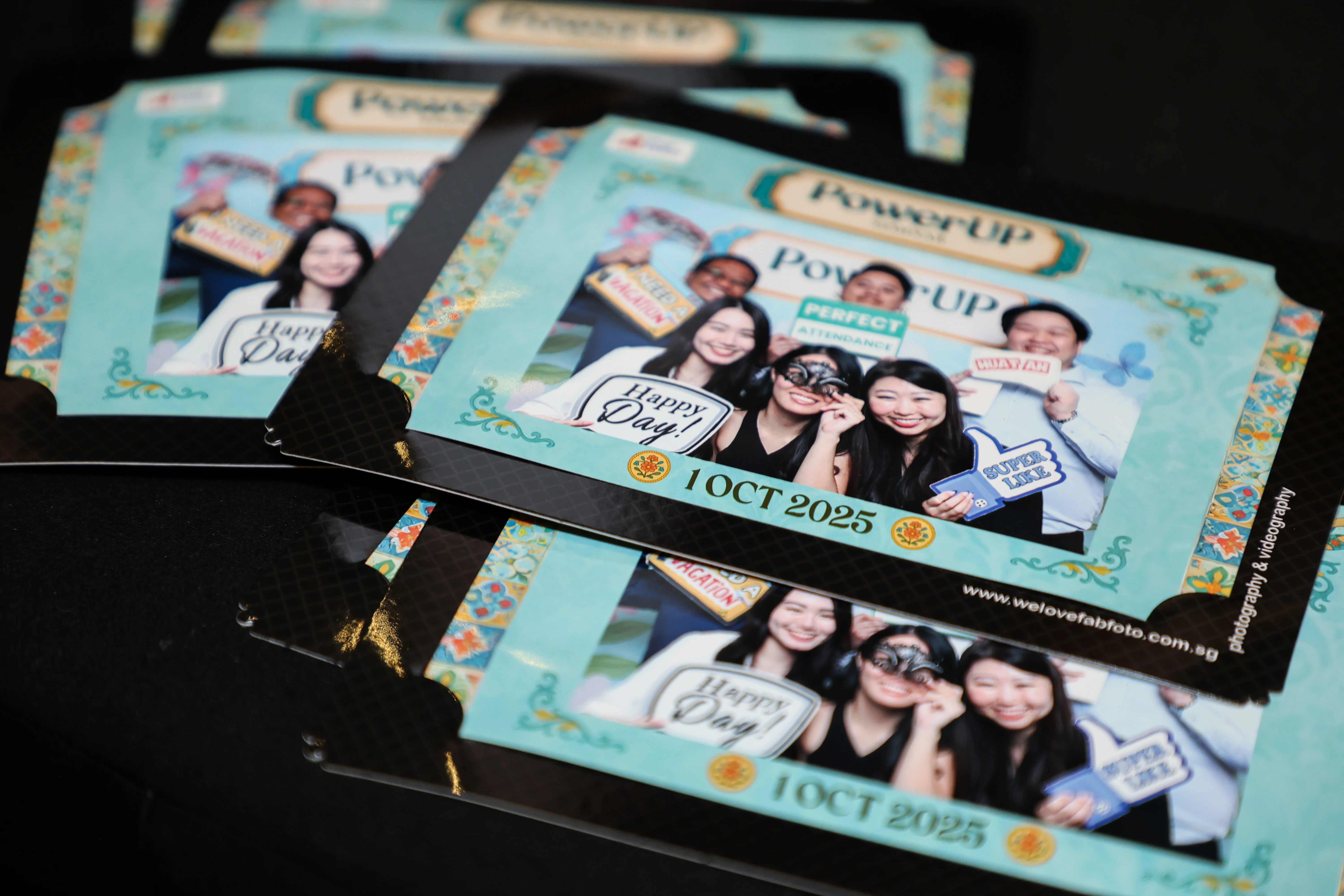 Custom photo prints with branded borders displayed on table