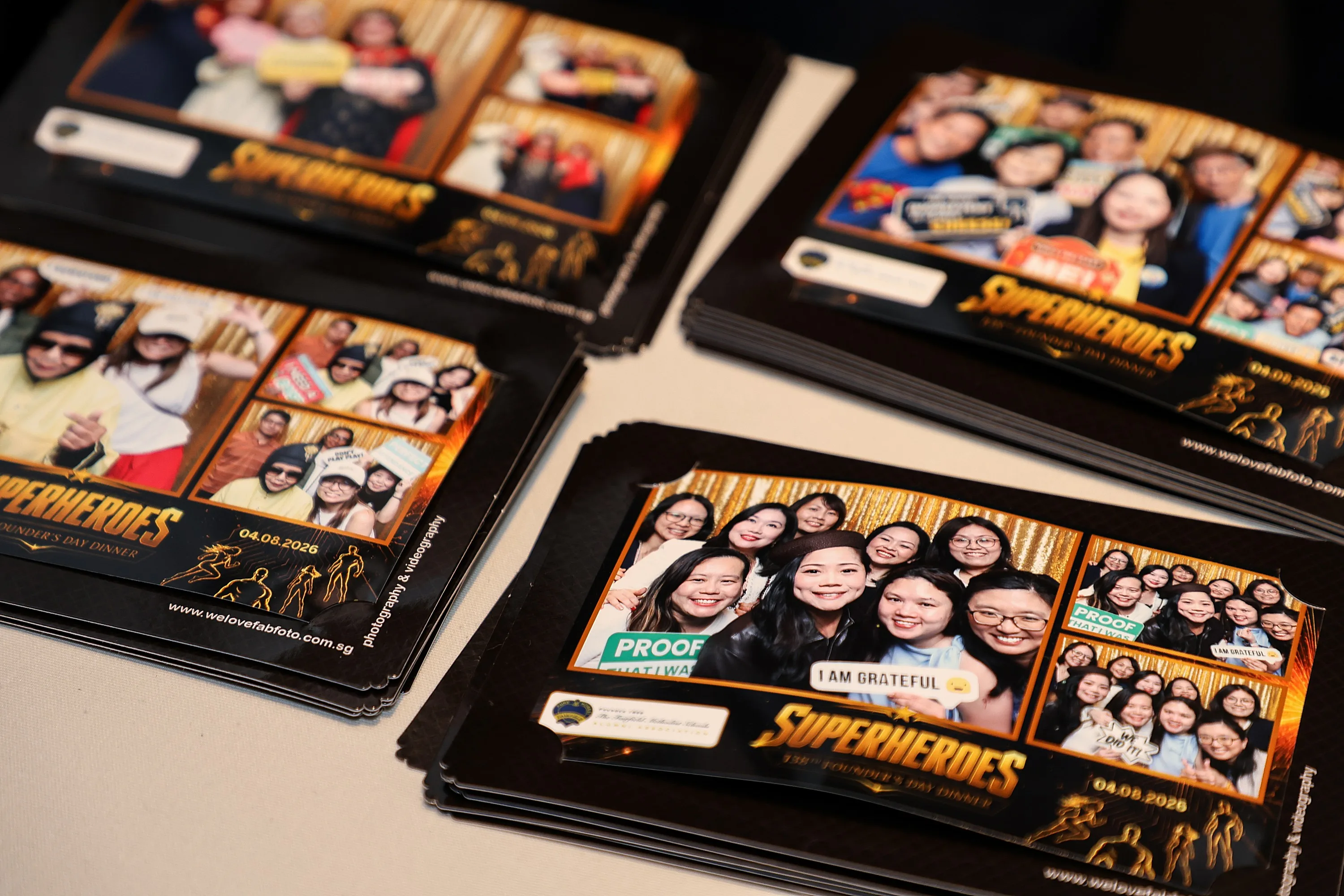 Stacks of high quality custom printed 4R photo strips from an event photobooth