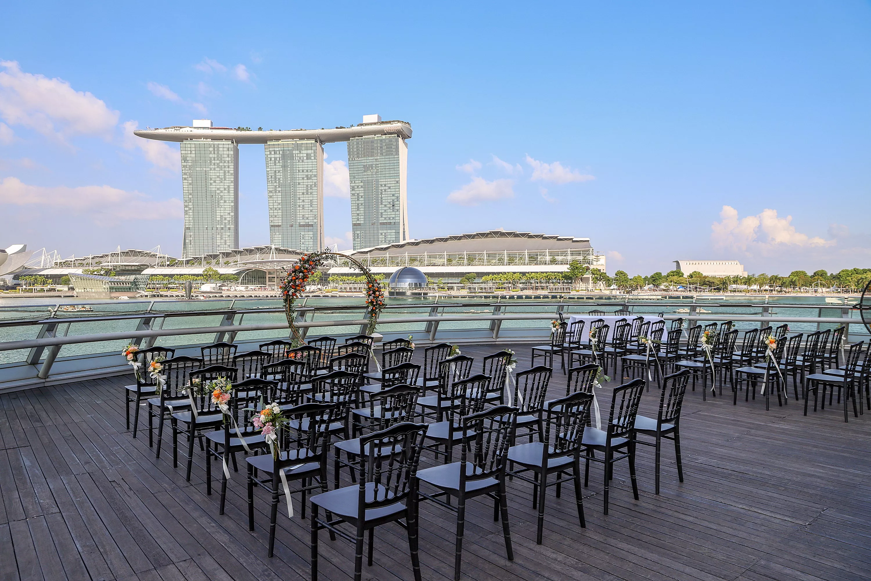 Outdoor wedding solemnization setup overlooking Marina Bay Sands Singapore