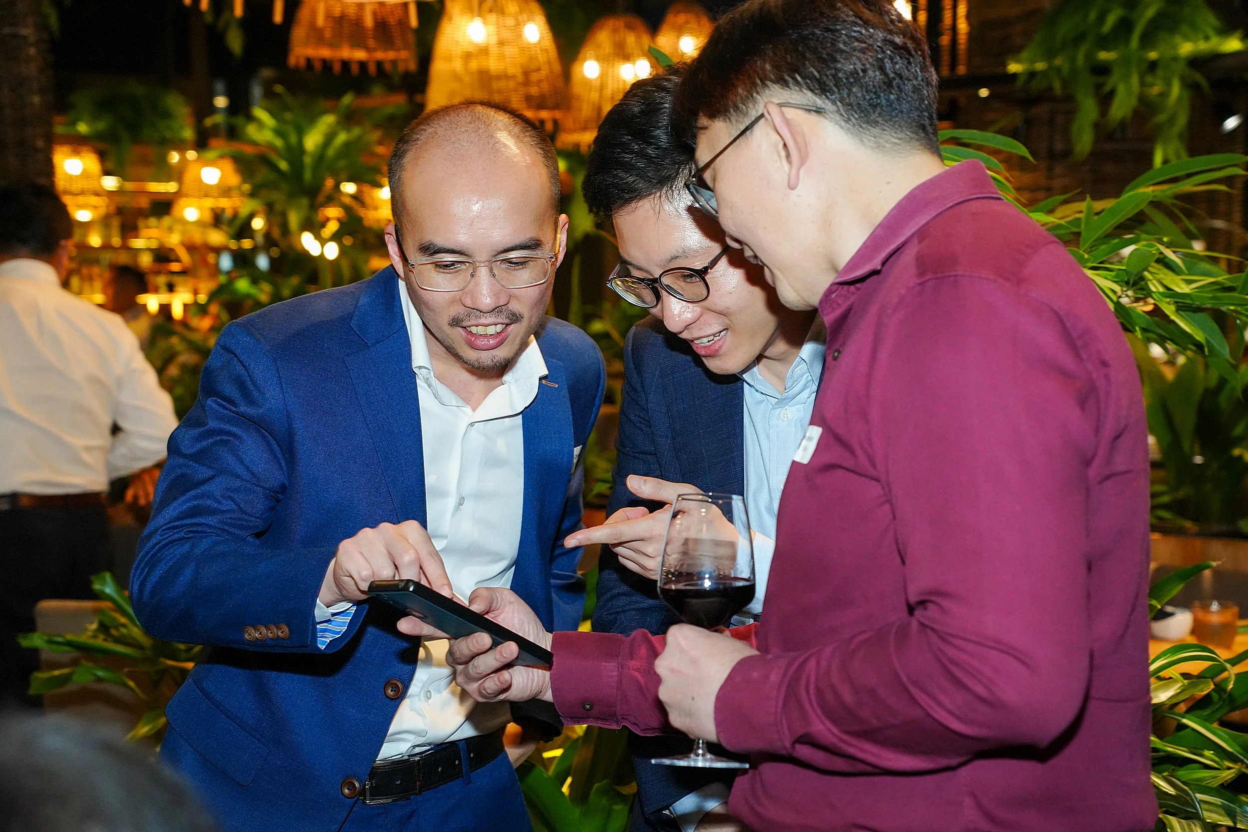 Event attendees sharing photos on smartphones using an event hashtag