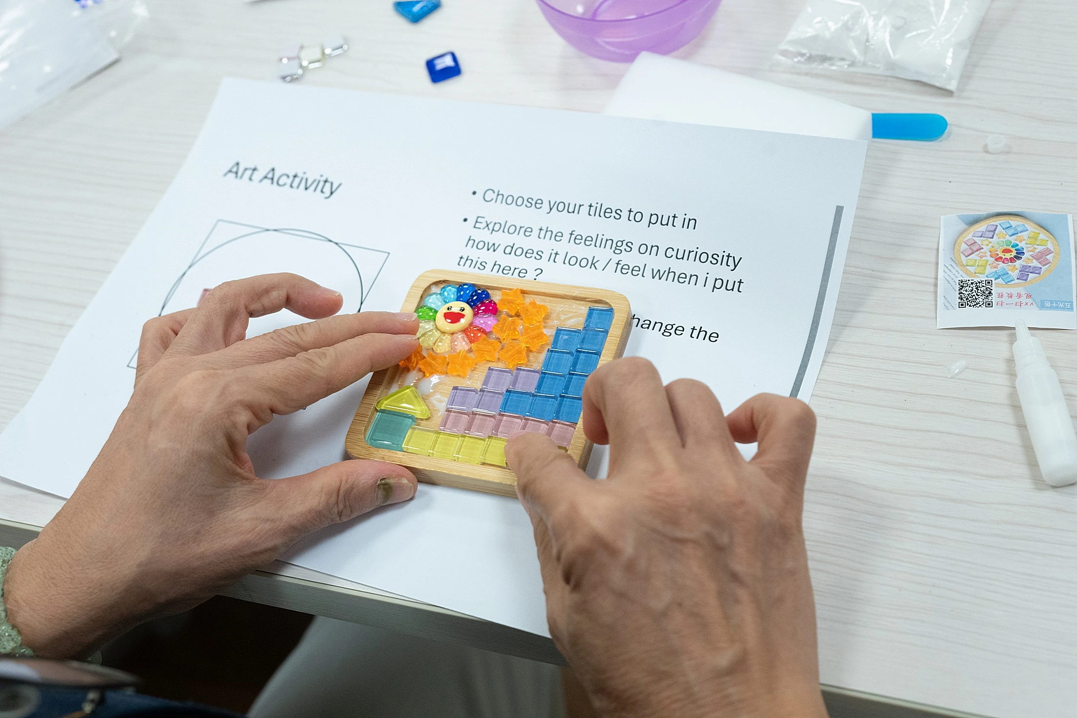 Guests participating in an interactive craft and game activity at a Singapore corporate event