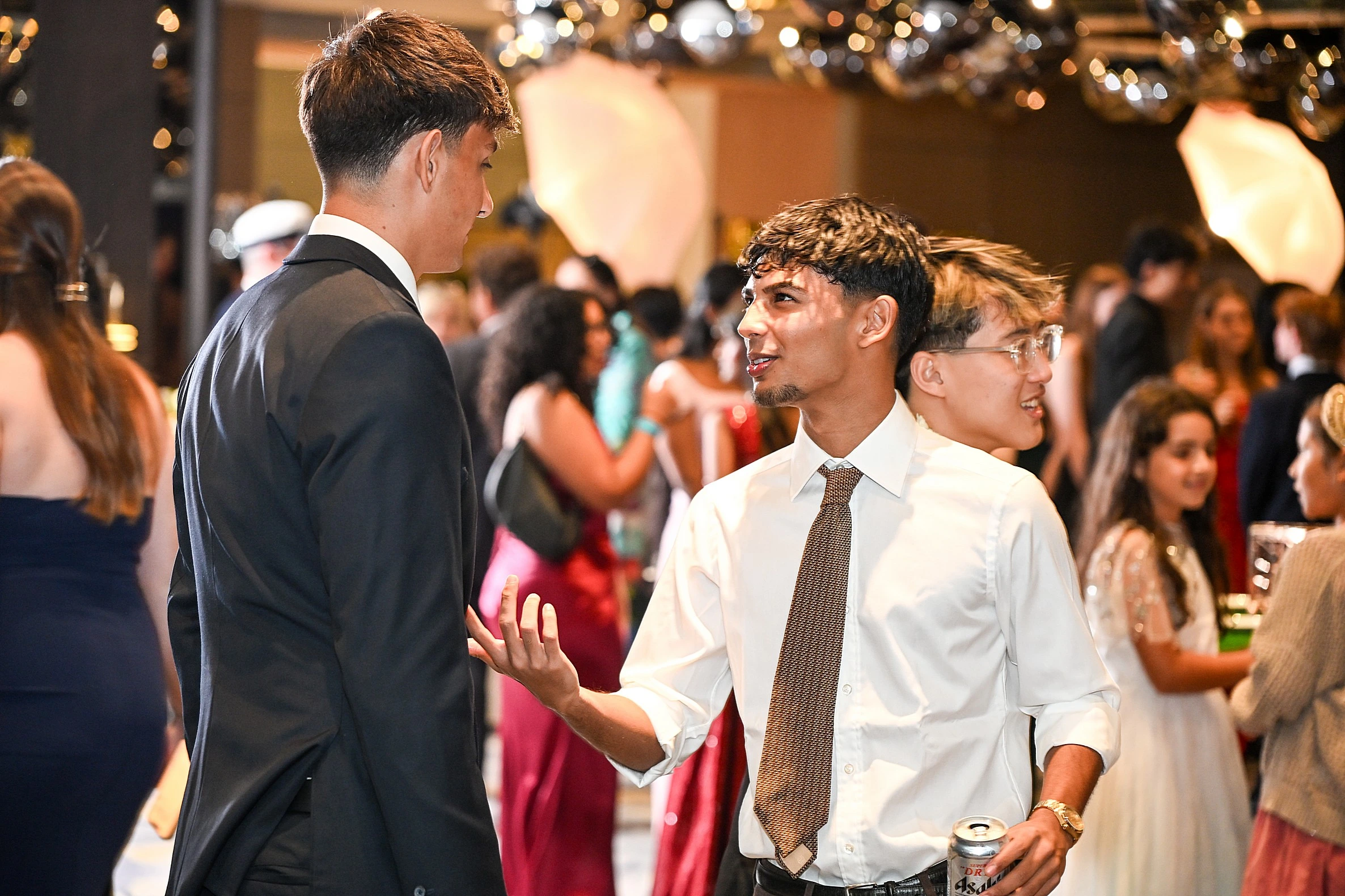 Corporate professionals conversing during a networking session in Singapore