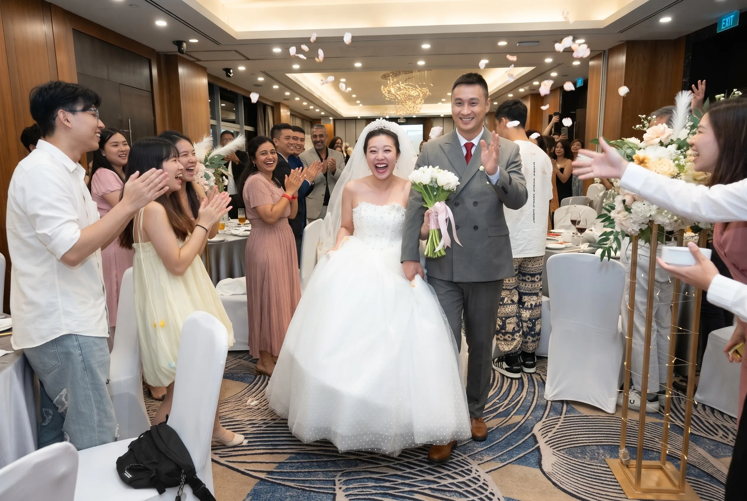 Joyful people at a wedding reception with a photo booth
